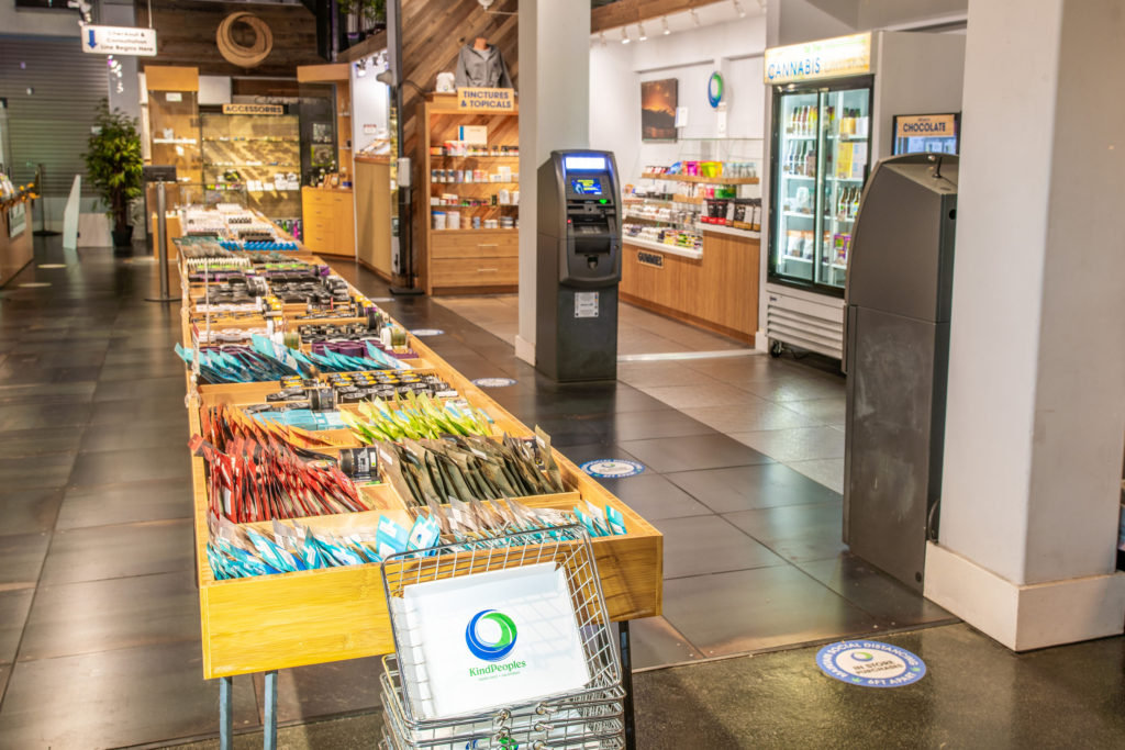 an interior photo of a cannabis dispensary featuring shoppable product displays